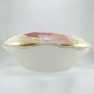 Centro de mesa de diseño en cristal decorado con hojas y pan de oro